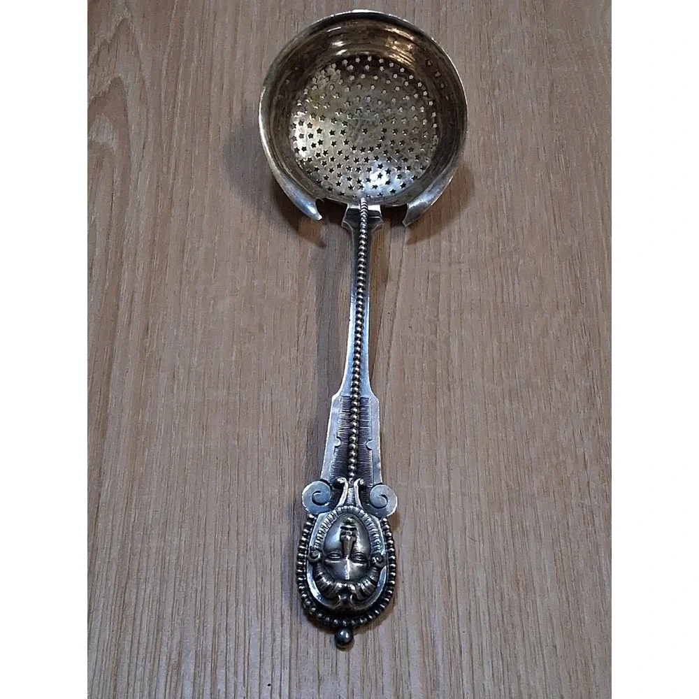 WOOD & HUGHES pierced Serving Ladle / Sifter MEDALLION 3D face. Rare 1870s